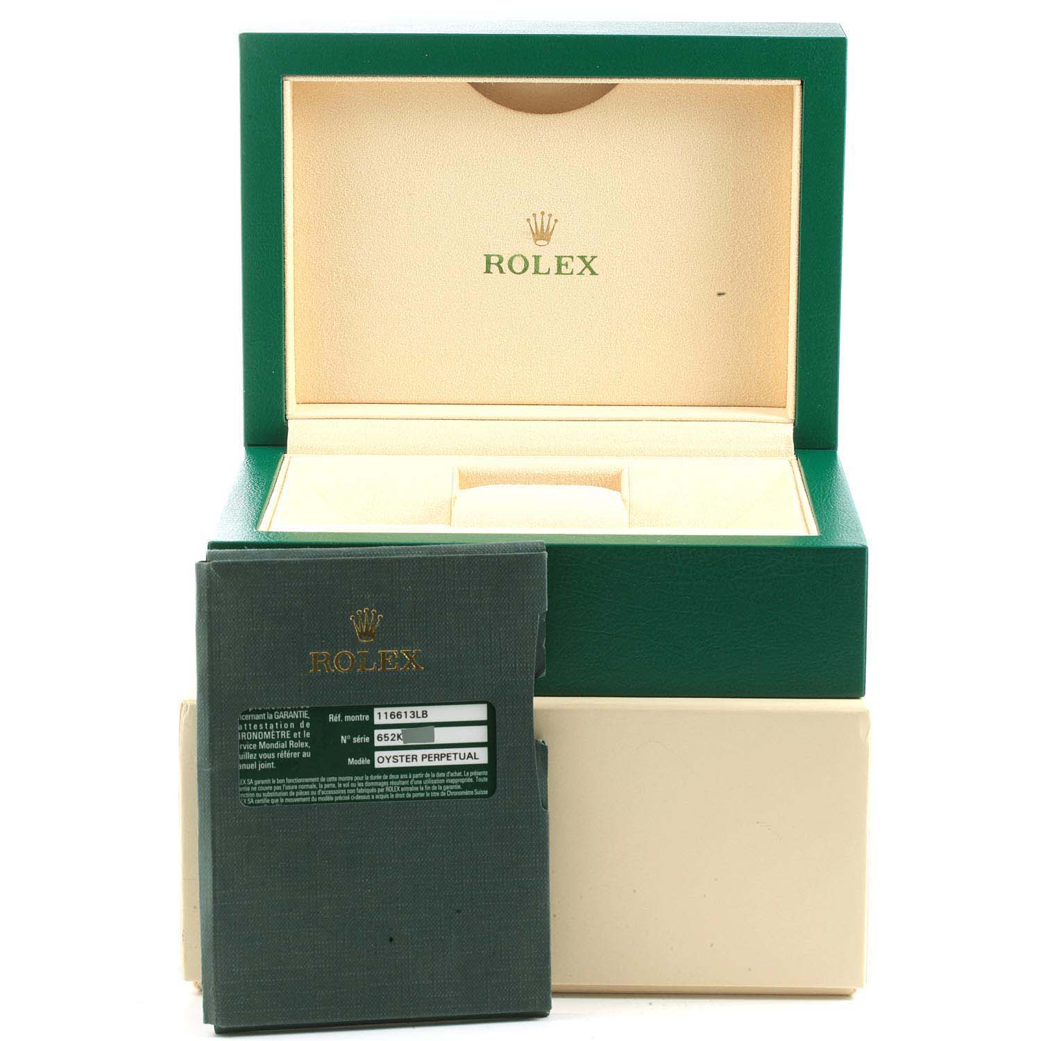 The image shows the packaging and documentation for the Rolex Submariner 116613 Men's Steel and Gold (two tone) Blue Dial 116613 Men's Steel and Gold (two tone) Blue Dial, including the green box and warranty card.