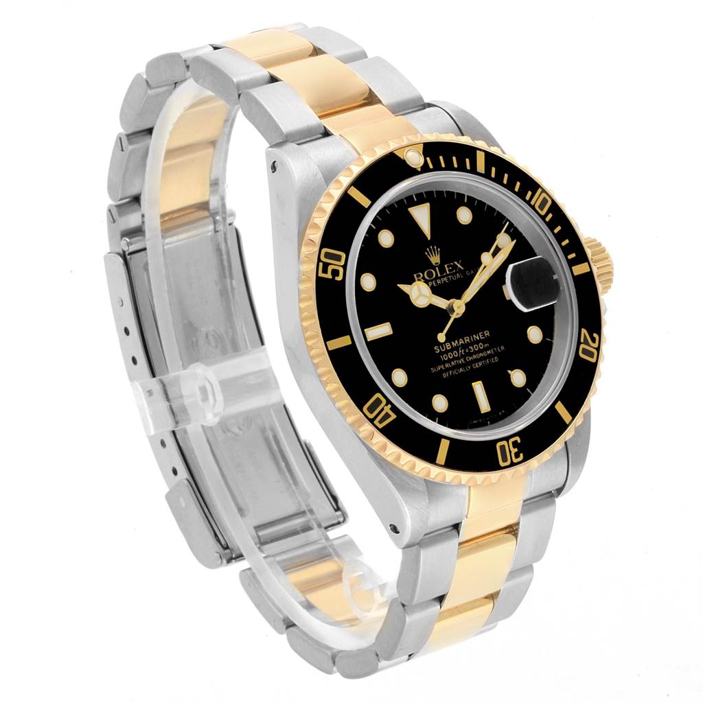 The image shows a Rolex Submariner 16613 Men's Steel and Gold (two tone) Black Dial 16613 Men's Steel and Gold (two tone) Black Dial watch at a slight angle, highlighting its black dial, bezel, and stainless steel and gold bracelet.
