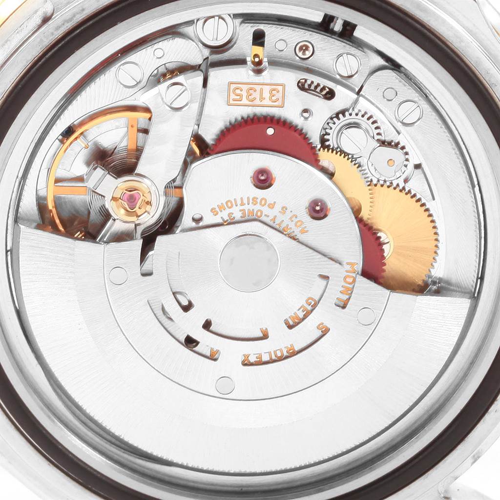 This image shows the inner mechanism and movement of a Rolex Submariner 16613 Men's Steel and Gold (two tone) Blue Dial 16613 Men's Steel and Gold (two tone) Blue Dial watch from a top-down angle.