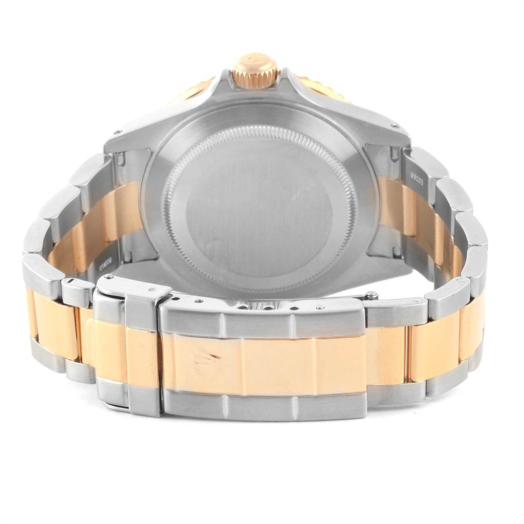 The image shows the back case and the bracelet of a Rolex Submariner 16613 Men's Steel and Gold (two tone) Blue Dial 16613 Men's Steel and Gold (two tone) Blue Dial watch.