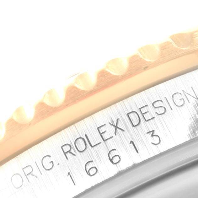 The image shows a close-up of the bezel and case side of a Rolex Submariner 16613 Men's Steel and Gold (two tone) Blue Dial 16613 Men's Steel and Gold (two tone) Blue Dial, displaying part of the model number "16613".