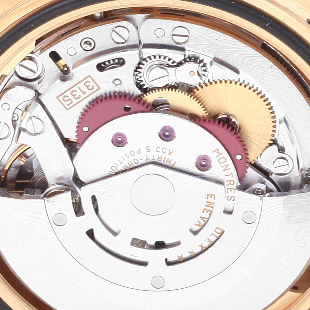 This image shows the internal mechanical movement of a Rolex Submariner 16618 Men
s Yellow Gold Black Dial 16618 Men
s Yellow Gold Black Dial watch, focusing on the gears and rotor.