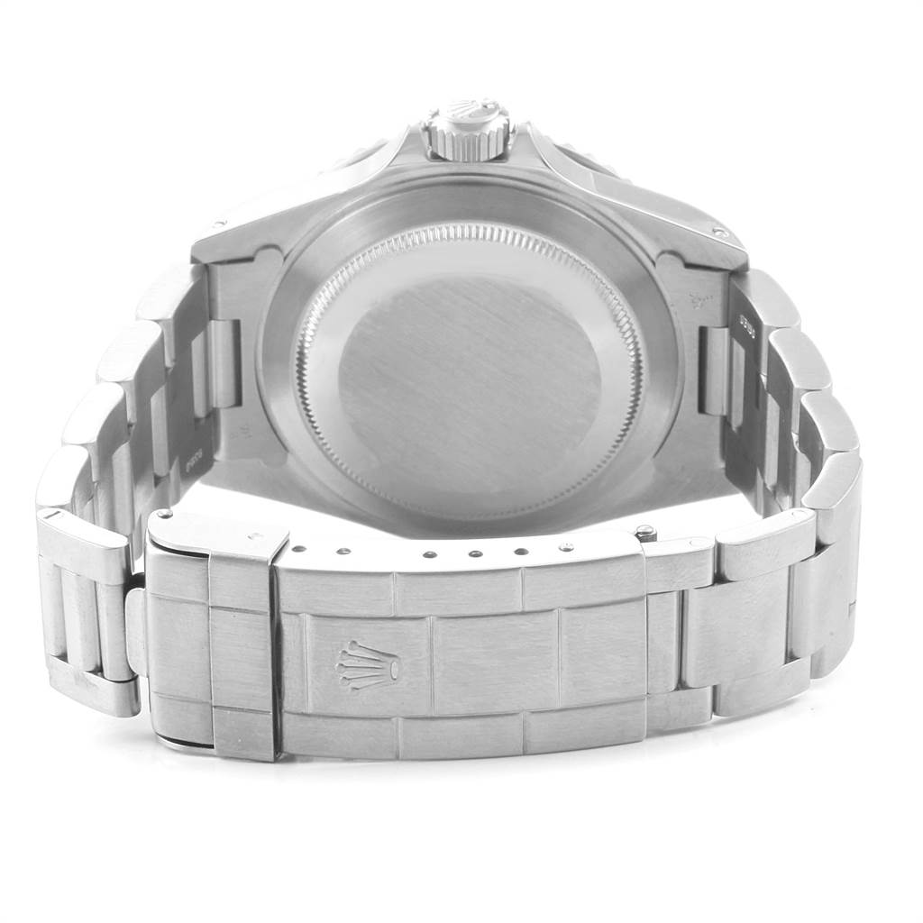 The image shows the back view of a Rolex Submariner 14060 Men
s Stainless Steel Black Dial 14060 Men
s Stainless Steel Black Dial watch, highlighting its stainless steel case back and metal bracelet.