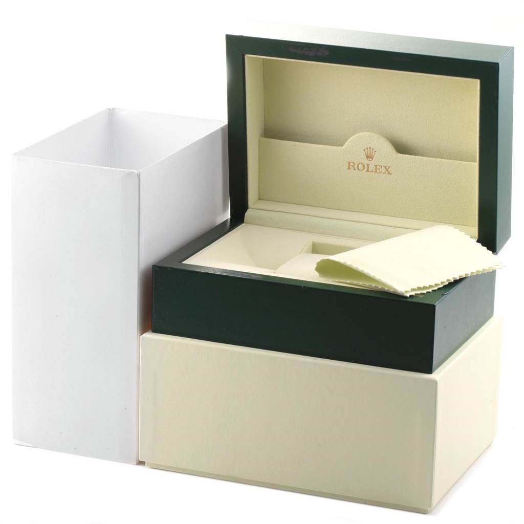 The image shows an empty Rolex Submariner 14060 Men
s Stainless Steel Black Dial 14060 Men
s Stainless Steel Black Dial watch box and accessories at an angled view, including a cleaning cloth and outer packaging.