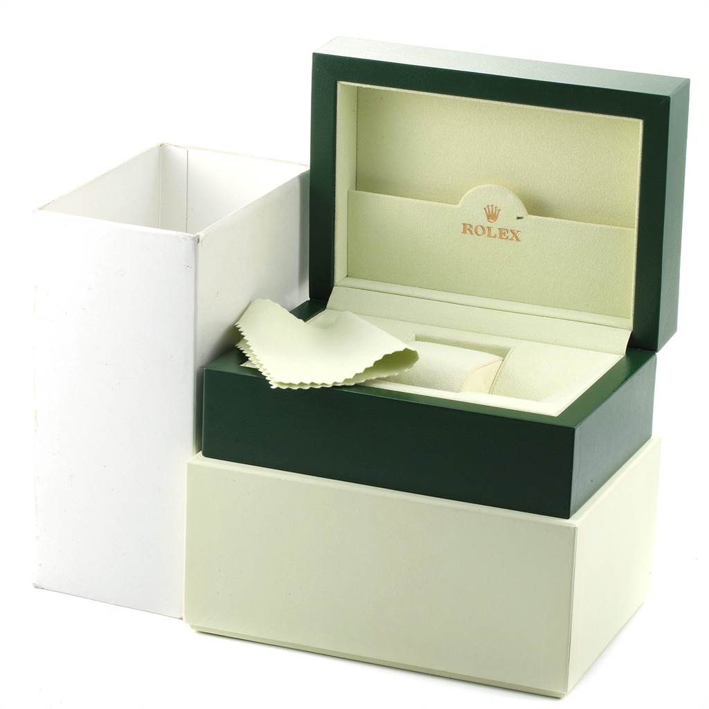 The image shows the open green and cream-colored box for a Rolex Submariner 16613 Men
s Steel and Gold (two tone) Grey Dial 16613 Men
s Steel and Gold (two tone) Grey Dial watch along with a white cloth.