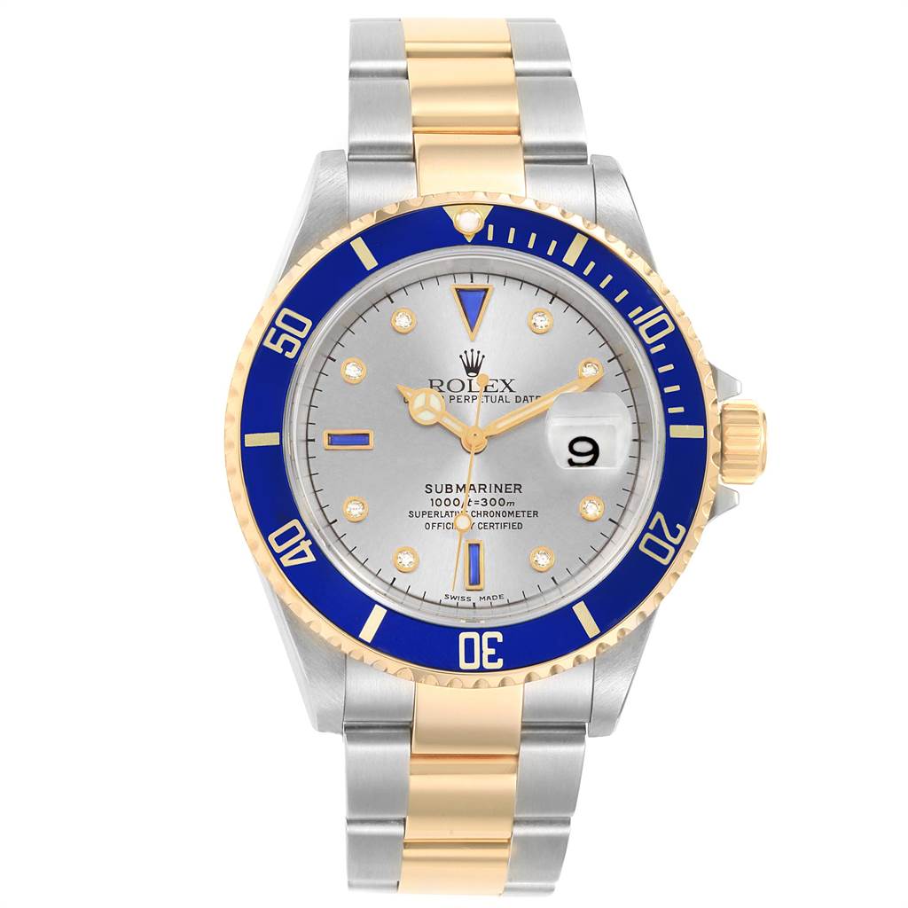 The image shows a front view of a Rolex Submariner 16613 Men
s Steel and Gold (two tone) Grey Dial 16613 Men
s Steel and Gold (two tone) Grey Dial watch with a silver dial, blue bezel, and two-tone gold and silver bracelet.