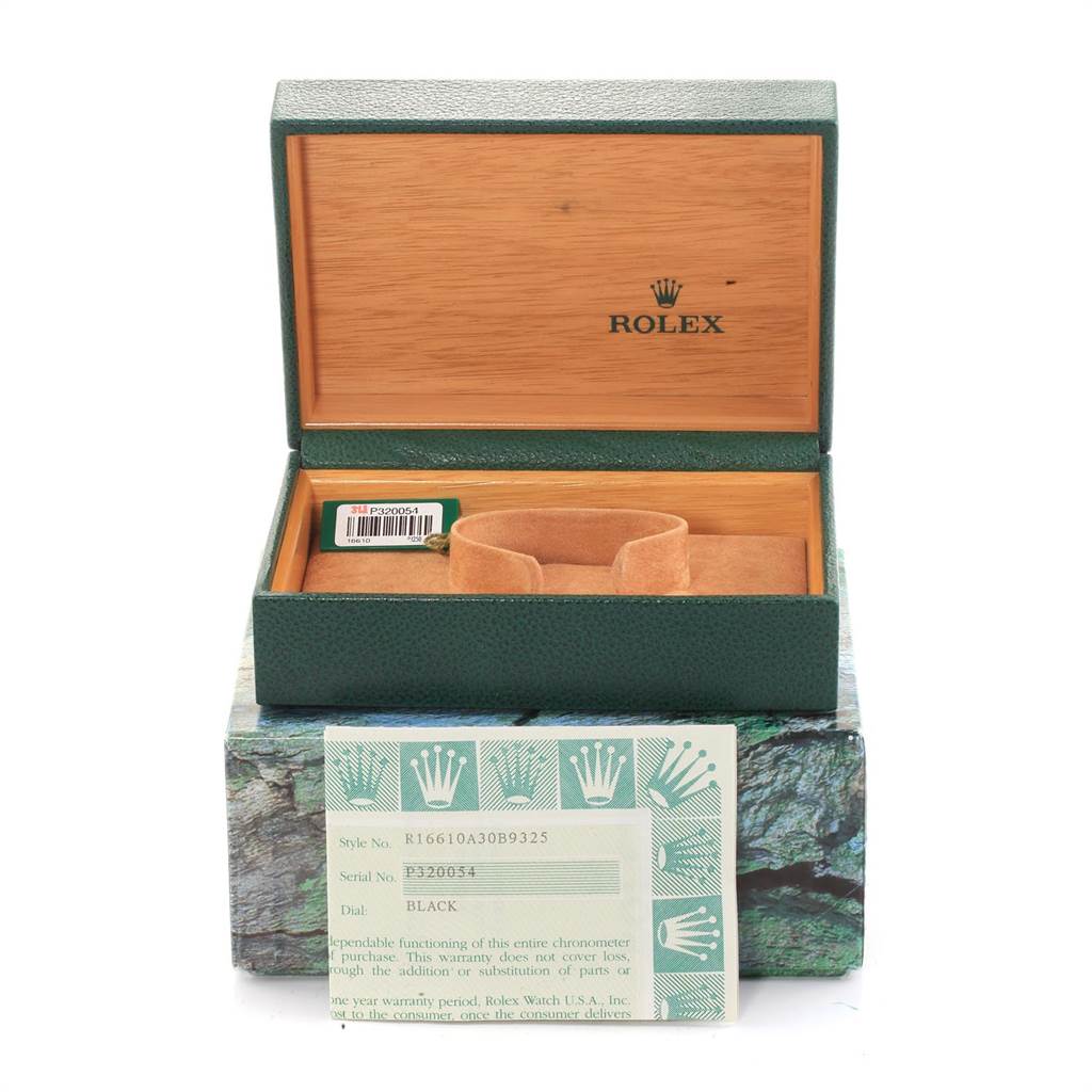 The image shows the packaging, box, pillow, and warranty card of a Rolex Submariner 16610 Men
s Stainless Steel Black Dial 16610 Men
s Stainless Steel Black Dial watch.