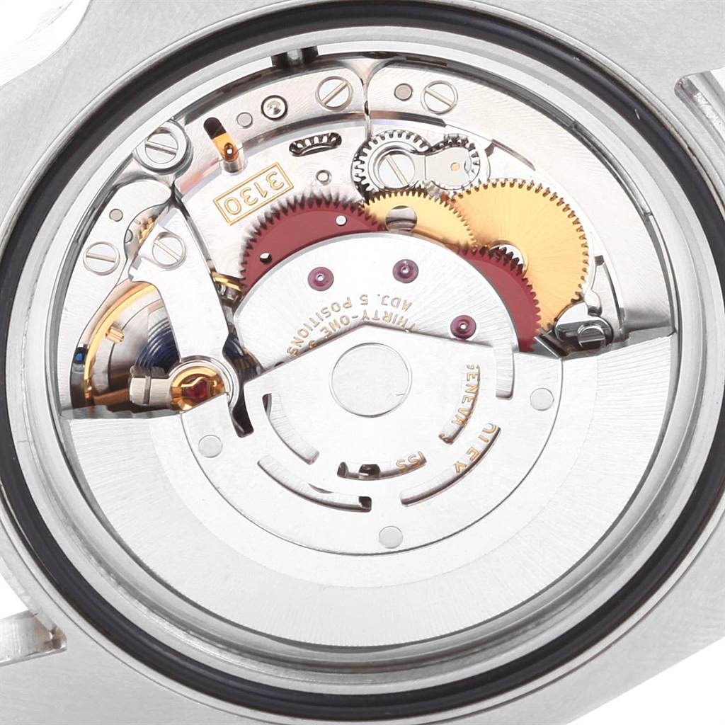 This image shows the inner mechanism of a Rolex Submariner 114060 Men
s Stainless Steel Black Dial 114060 Men
s Stainless Steel Black Dial watch, displaying gears and intricate details from a top-down angle.