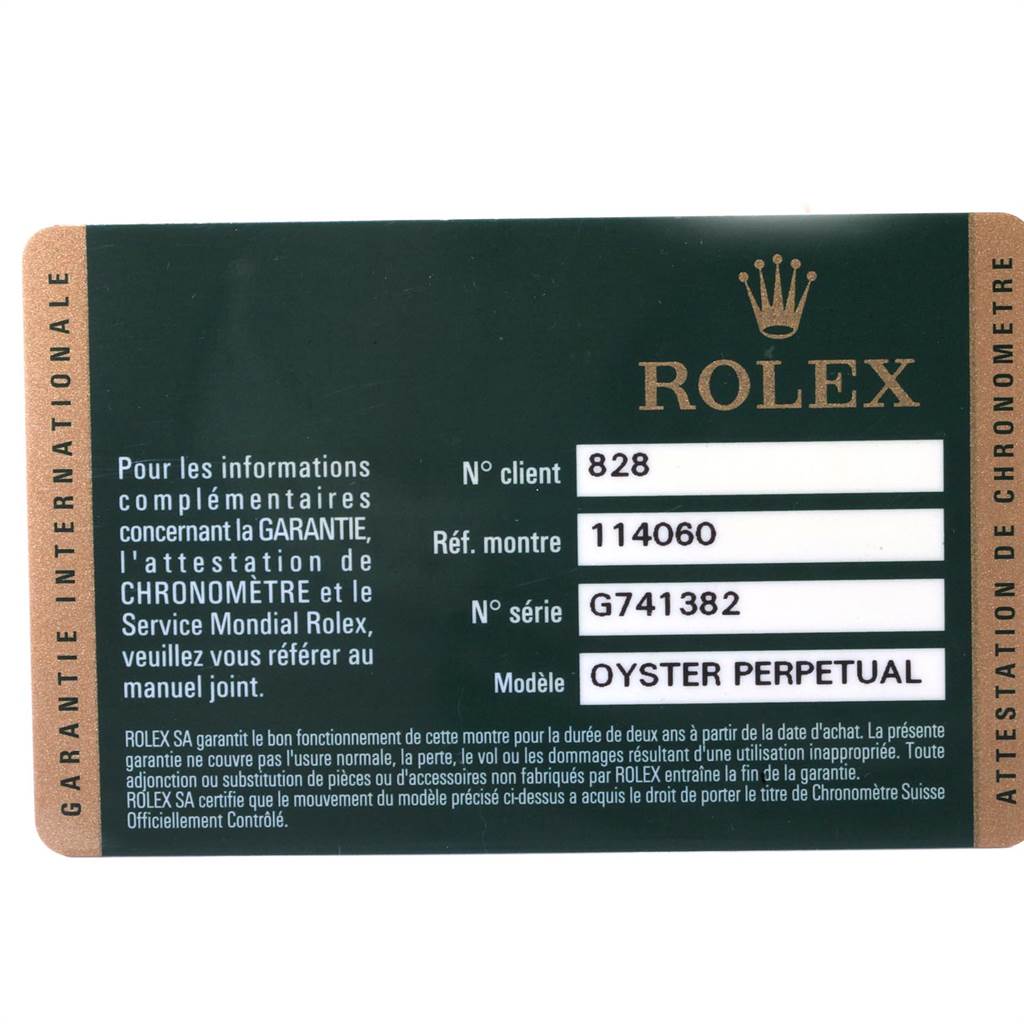 This is a close-up image of a Rolex Submariner 114060 Men
s Stainless Steel Black Dial 114060 Men
s Stainless Steel Black Dial model warranty card.