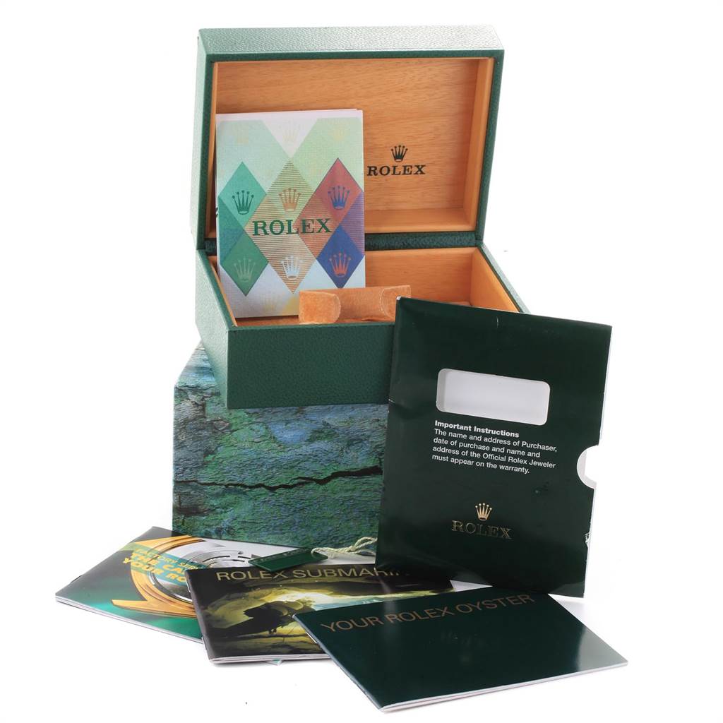 The image shows a green and brown Rolex Submariner 16610LV Men's Stainless Steel Black Dial 16610LV Men's Stainless Steel Black Dial box with instruction manuals and warranty cards.