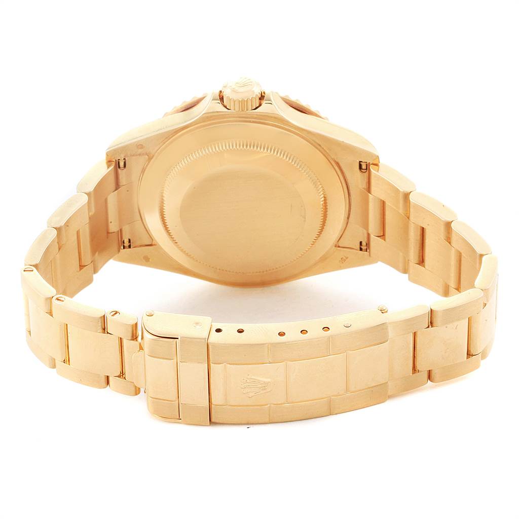 This image shows the back and bracelet of a Rolex Submariner 16618 Men
s Yellow Gold Blue Dial 16618 Men
s Yellow Gold Blue Dial watch in gold, viewed from a rear angle.