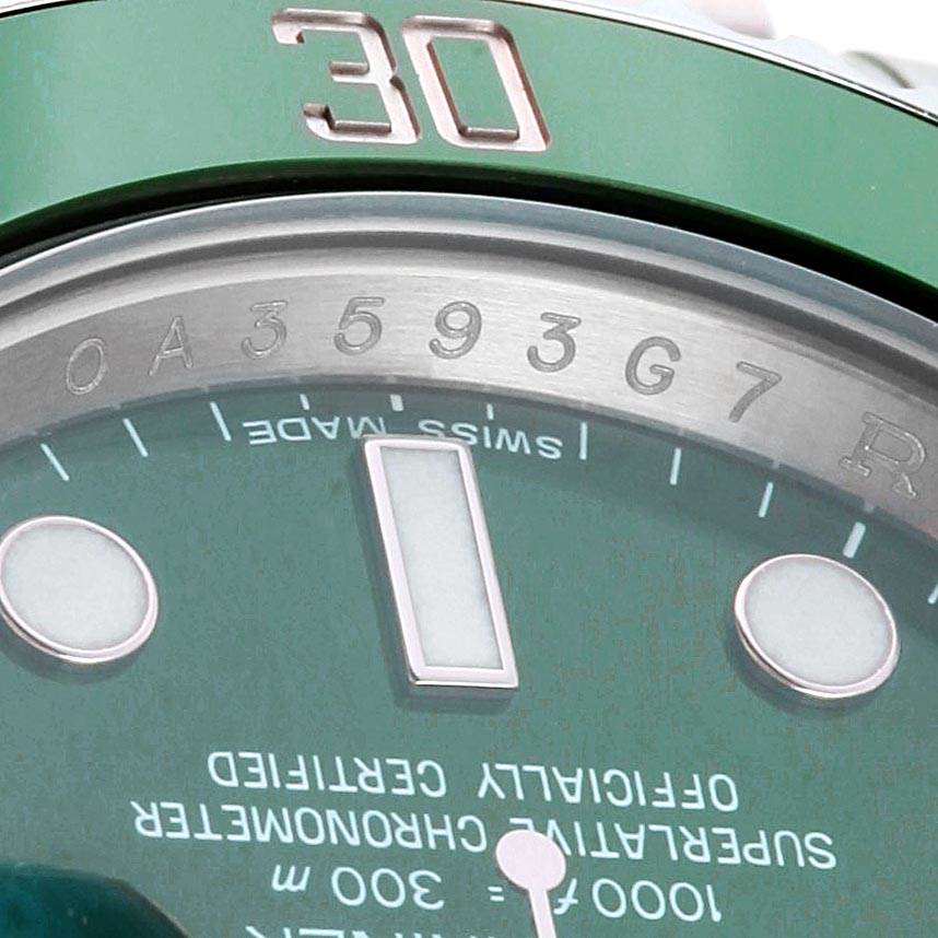 This image shows a close-up view of the dial and bezel of a Rolex Submariner 116610LV Men
s Stainless Steel Green Dial 116610LV Men
s Stainless Steel Green Dial watch, highlighting the 30-minute marker and serial number.