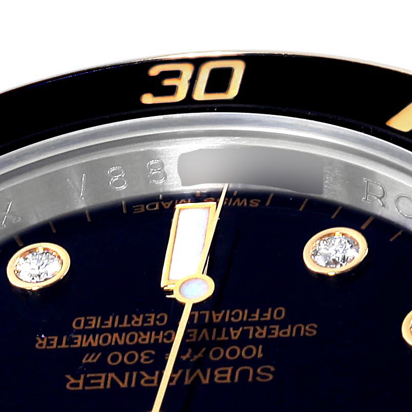 The image shows a close-up of the bezel, dial, and part of the minute marker on a Rolex Submariner 116613 Men's Steel and Gold (two tone) Black Dial 116613 Men's Steel and Gold (two tone) Black Dial watch.