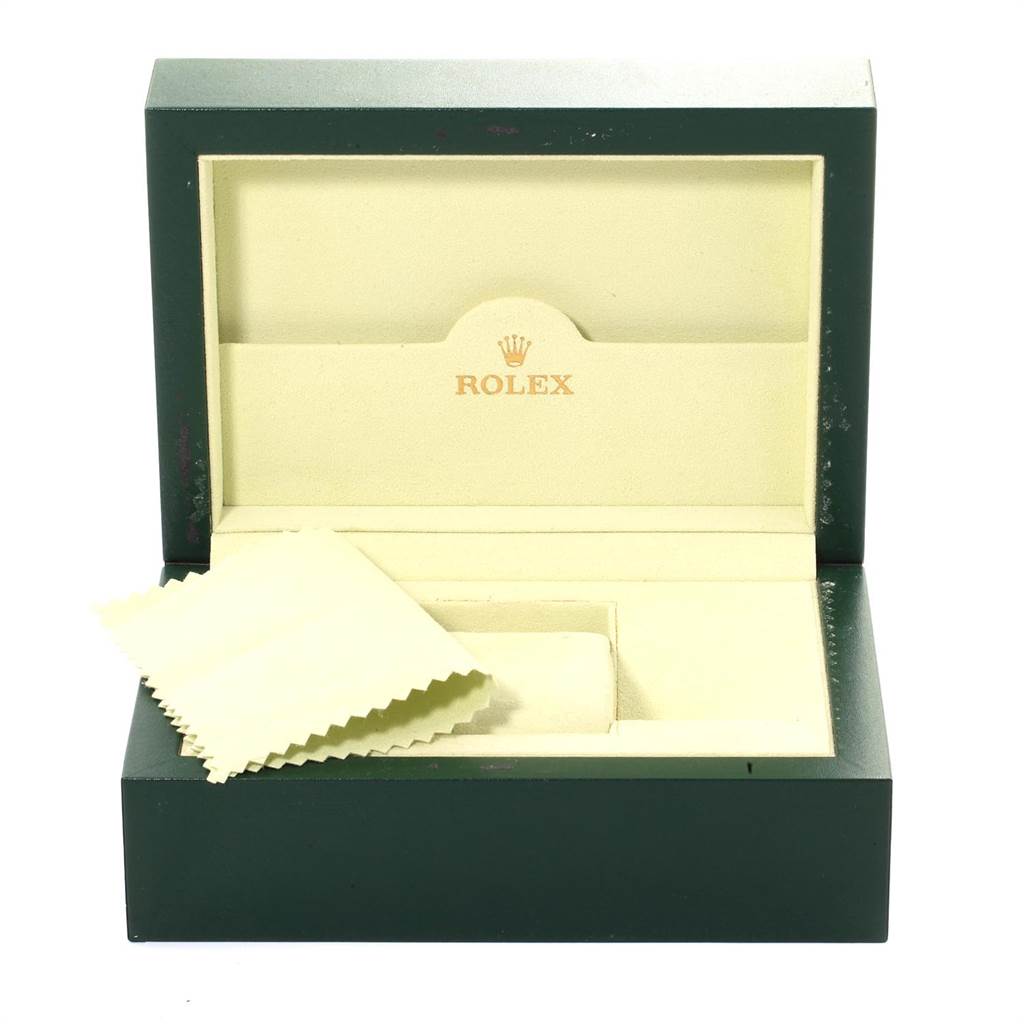 The image shows an open Rolex Submariner 14060 Men
s Stainless Steel Black Dial 14060 Men
s Stainless Steel Black Dial watch box with an included cleaning cloth inside.