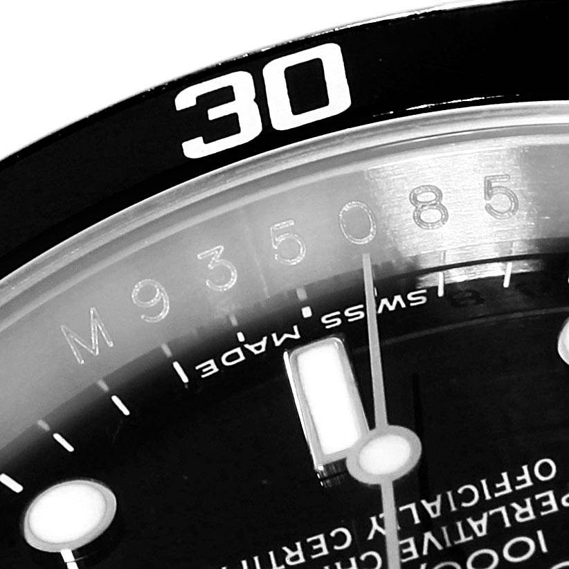 The image shows a close-up of the dial and bezel of a Rolex Submariner 16610 Men
s Stainless Steel Black Dial 16610 Men
s Stainless Steel Black Dial, focusing on the "30" mark on the bezel and the "Swiss Made" text.