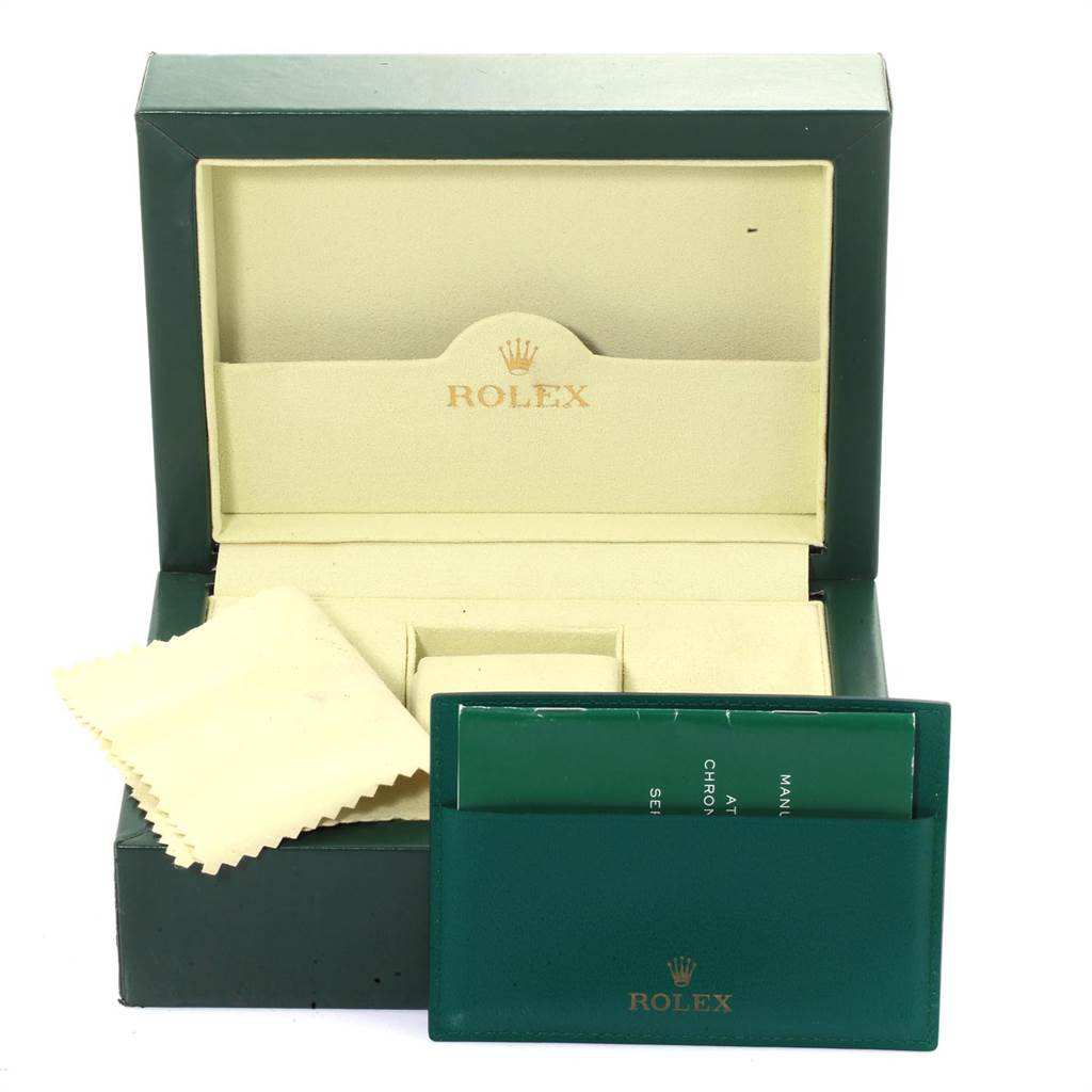 The image shows the packaging, cloth, and documentation for a Rolex Submariner 16610 Men
s Stainless Steel Black Dial 16610 Men
s Stainless Steel Black Dial watch.