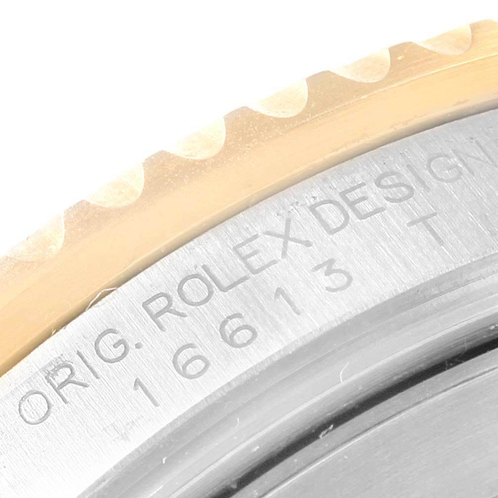 This close-up image shows the model number and the bezel of the Rolex Submariner 16613 Men
s Steel and Gold (two tone) Champagne Dial 16613 Men
s Steel and Gold (two tone) Champagne Dial watch.