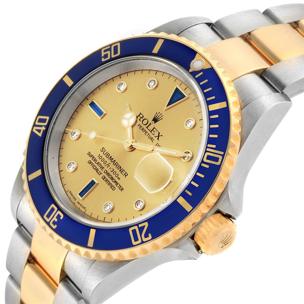 The Rolex Submariner 16613 Men
s Steel and Gold (two tone) Champagne Dial 16613 Men
s Steel and Gold (two tone) Champagne Dial watch is shown at a slight angle, displaying its dial, bezel, crown, and part of its bracelet.