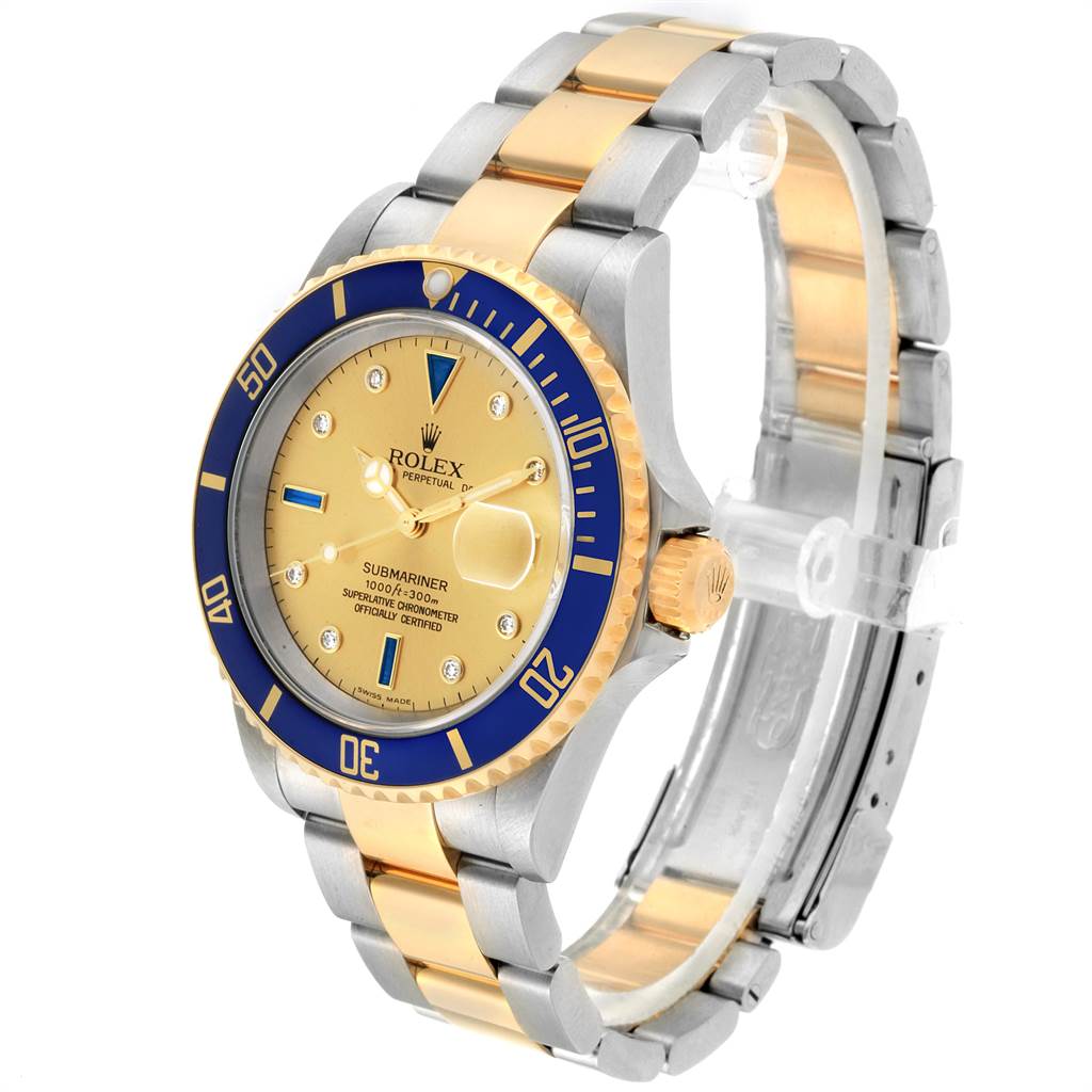 The image shows a Rolex Submariner 16613 Men
s Steel and Gold (two tone) Champagne Dial 16613 Men
s Steel and Gold (two tone) Champagne Dial watch at a three-quarter angle, showcasing the face, bezel, and two-tone bracelet.