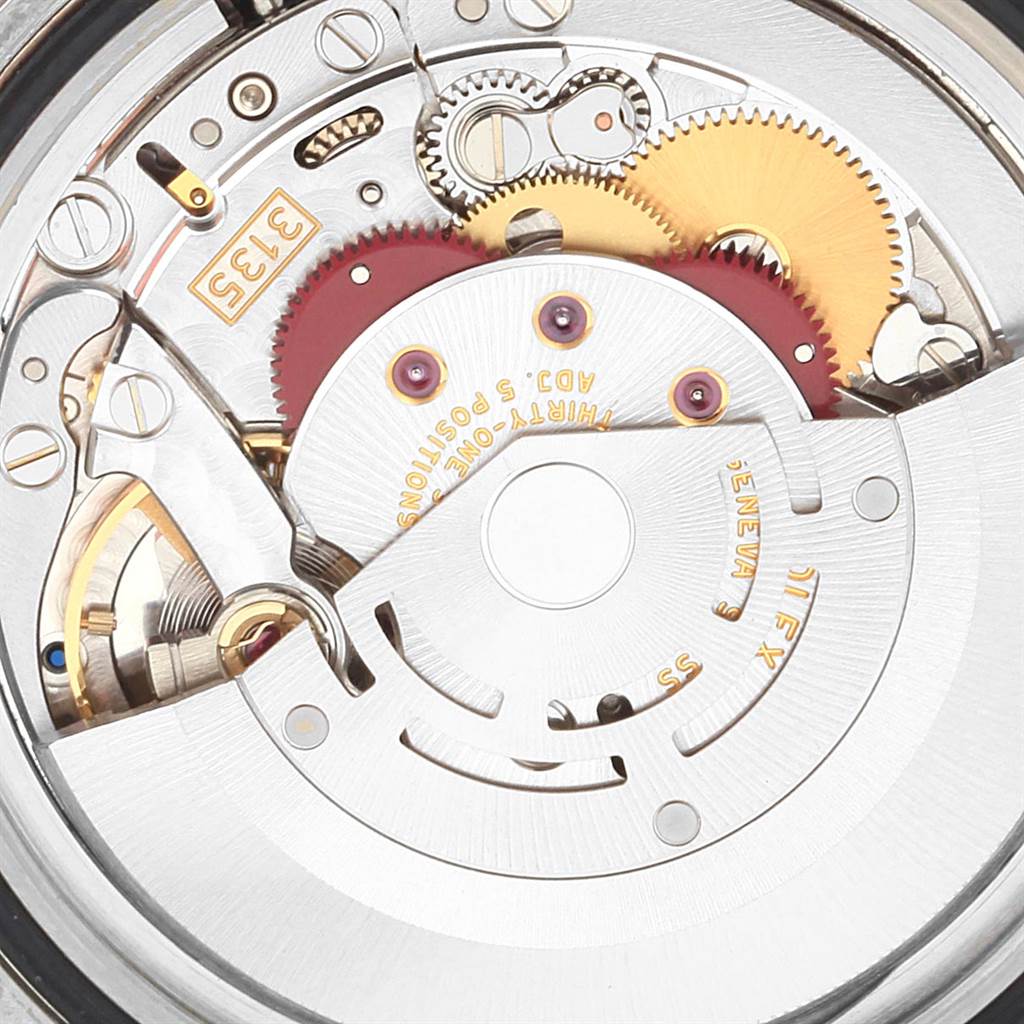 This image shows a close-up view of the internal movement and gears of a Rolex Submariner 16613 Men
s Steel and Gold (two tone) Champagne Dial 16613 Men
s Steel and Gold (two tone) Champagne Dial watch.