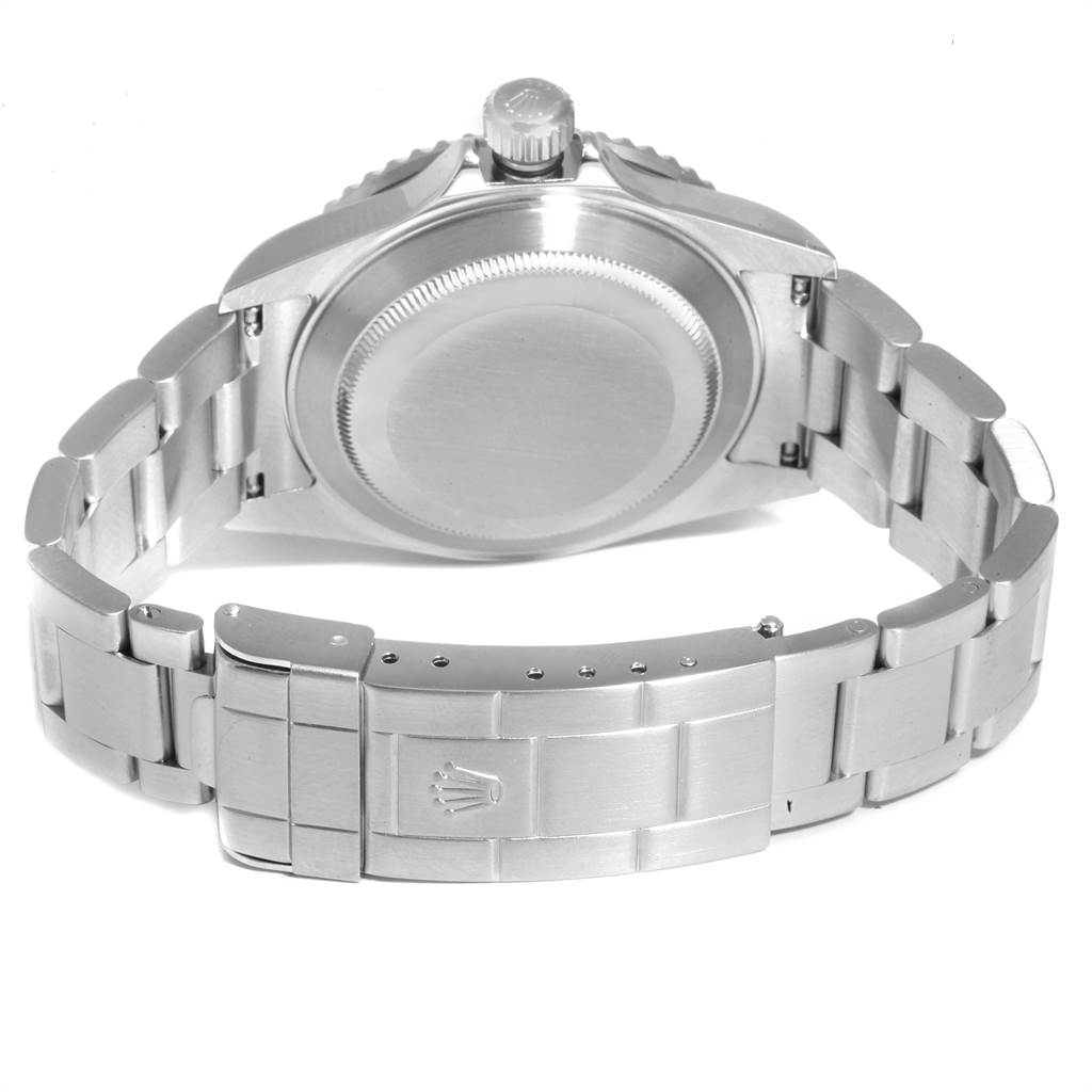 The image shows the back view of a Rolex Submariner 16610 Men
s Stainless Steel Black Dial 16610 Men
s Stainless Steel Black Dial, highlighting the clasp, bracelet, and caseback.