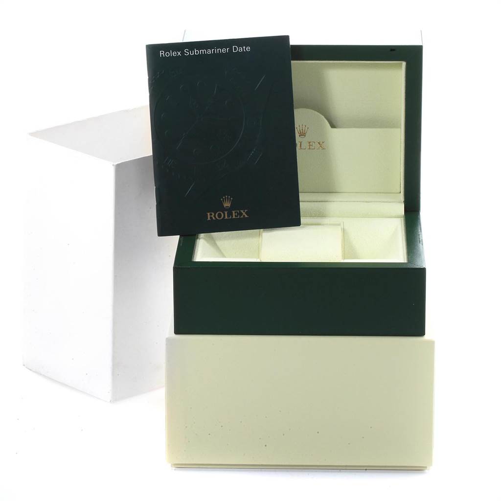 The image shows the open box and manual of a Rolex Submariner 16610 Men
s Stainless Steel Black Dial 16610 Men
s Stainless Steel Black Dial, brandishing Rolex logos.