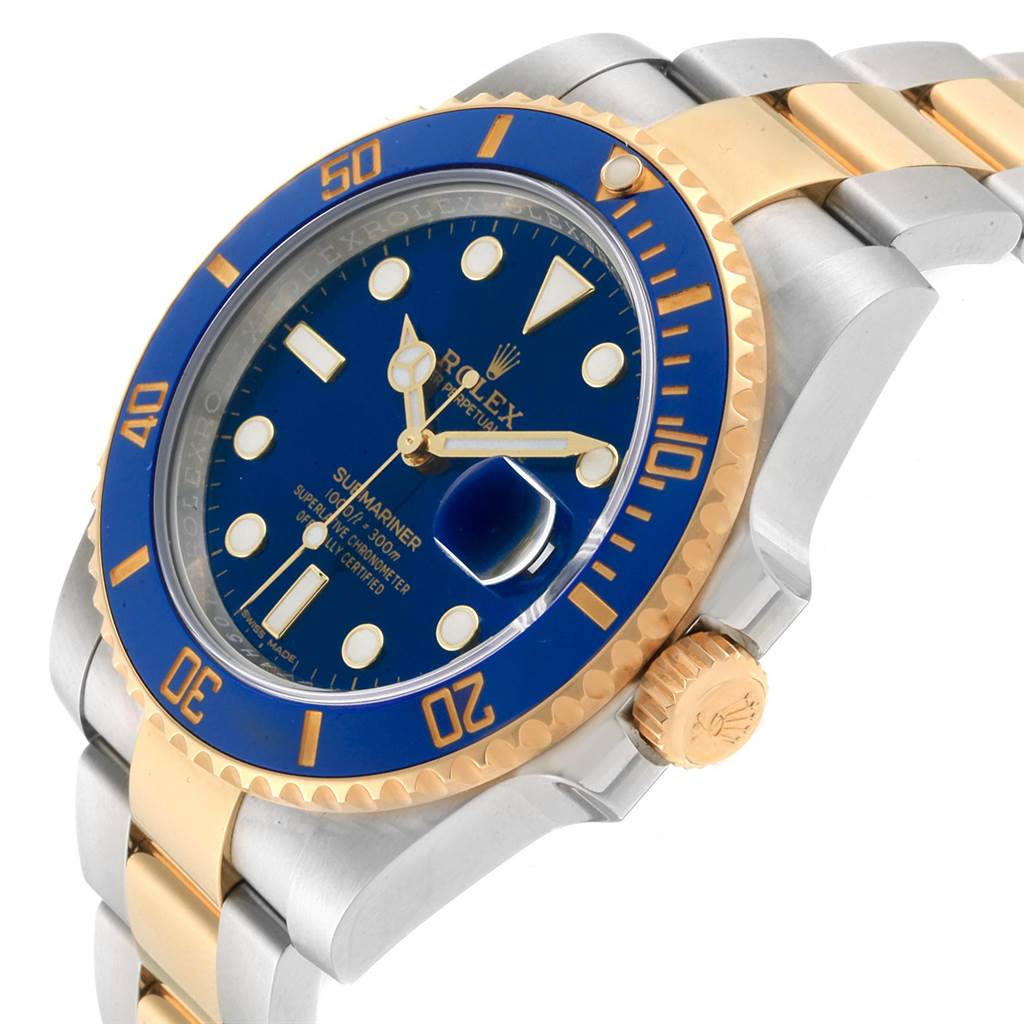 The image shows a side and angled view of a Rolex Submariner 116613 Men
s Steel and Gold (two tone) Blue Dial 116613 Men
s Steel and Gold (two tone) Blue Dial watch, highlighting its blue dial, gold and silver bracelet, and crown.