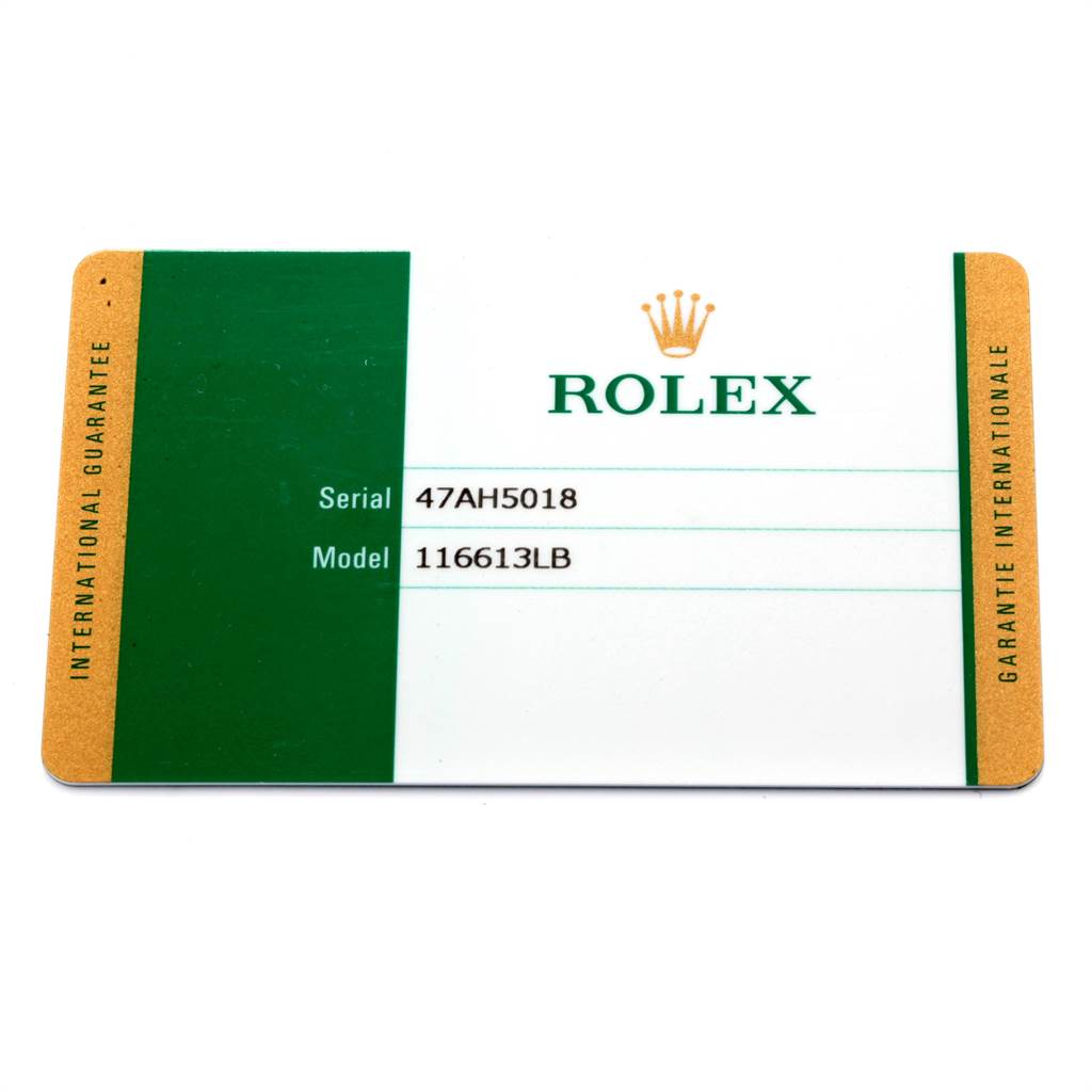 The image shows an international guarantee card for a Rolex Submariner 116613 Men
s Steel and Gold (two tone) Blue Dial 116613 Men
s Steel and Gold (two tone) Blue Dial model 116613LB.