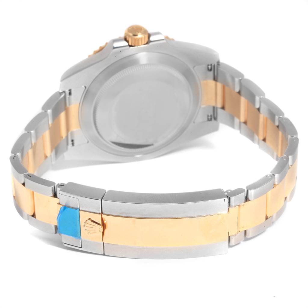 The image shows the back and bracelet of a Rolex Submariner 116613 Men
s Steel and Gold (two tone) Blue Dial 116613 Men
s Steel and Gold (two tone) Blue Dial watch, featuring a two-tone metal design.