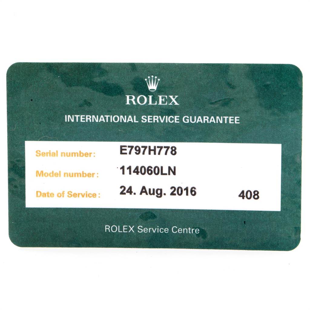 The image shows an International Service Guarantee card for a Rolex Submariner 114060 Men
s Stainless Steel Black Dial 114060 Men
s Stainless Steel Black Dial, model number 114060LN.