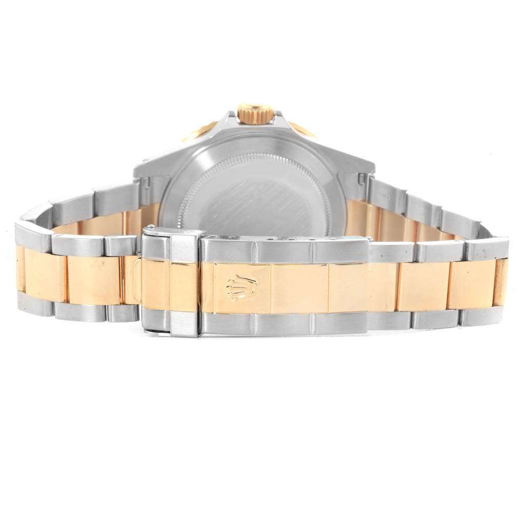 This image shows the back view of a Rolex Submariner 16613 Men
s Steel and Gold (two tone) Black Dial 16613 Men
s Steel and Gold (two tone) Black Dial watch, highlighting the case back and the two-tone bracelet with the clasp.