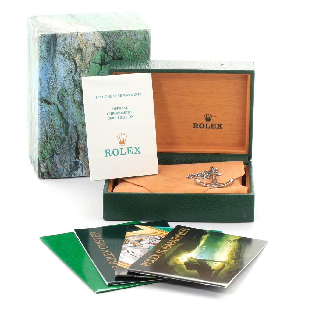 Shown are accessories for the Rolex Submariner 16613 Men
s Steel and Gold (two tone) Black Dial 16613 Men
s Steel and Gold (two tone) Black Dial, including the box, warranty, certification, pamphlets, and anchor token.