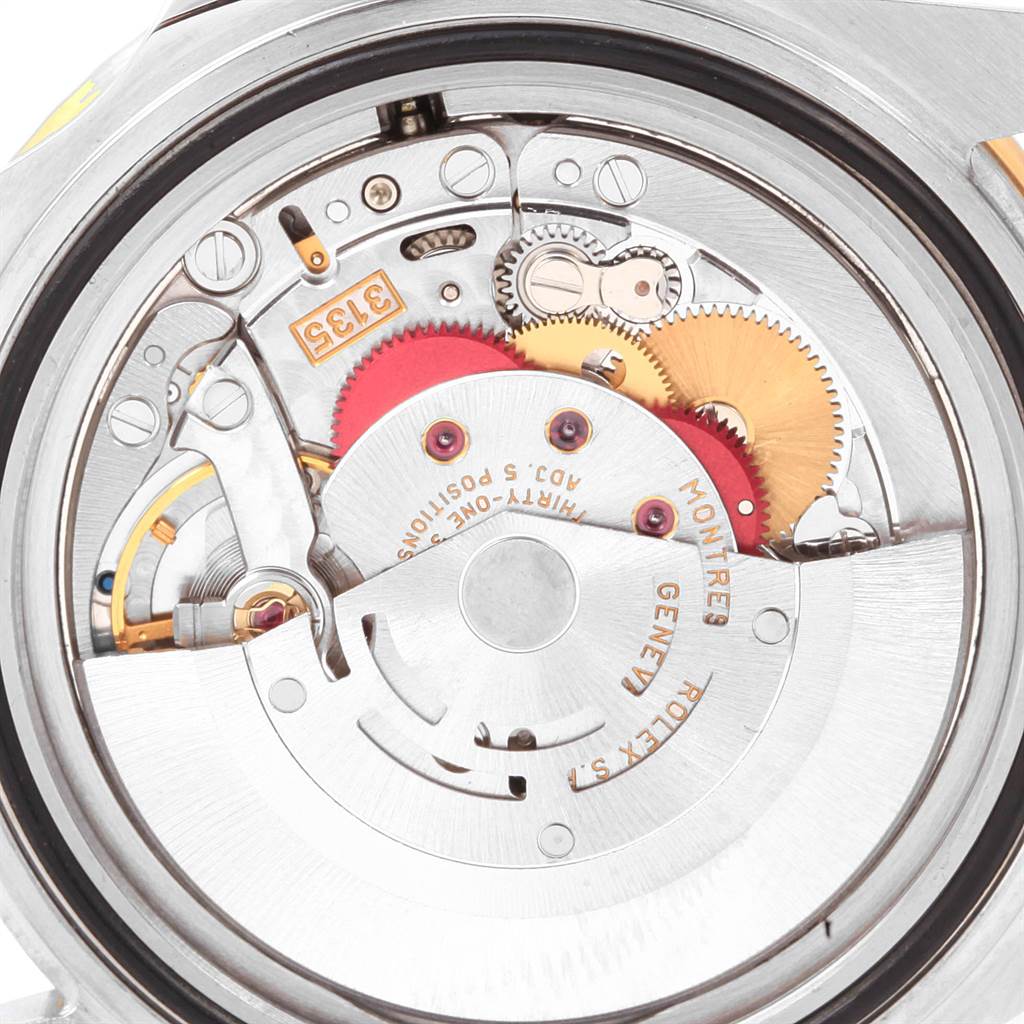 The image shows the rear view of the Rolex Submariner 16613 Men
s Steel and Gold (two tone) Black Dial 16613 Men
s Steel and Gold (two tone) Black Dial, exposing its intricate internal mechanical movement components.