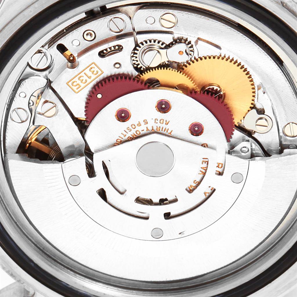 This image showcases the intricate inner mechanism of a Rolex Submariner 16610 Men
s Stainless Steel Black Dial 16610 Men
s Stainless Steel Black Dial watch, focusing on gears and components.