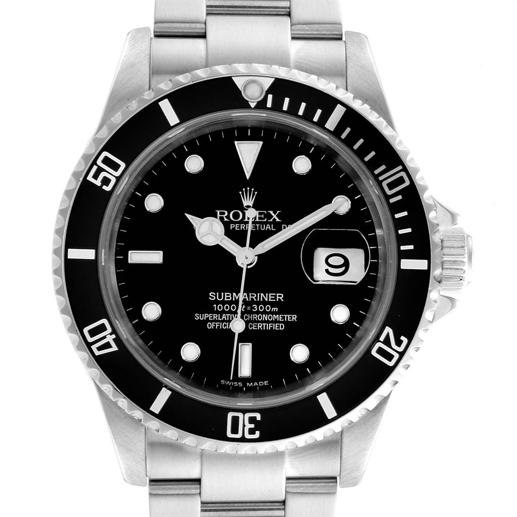 The image shows a close-up of a Rolex Submariner 16610 Men
s Stainless Steel Black Dial 16610 Men
s Stainless Steel Black Dial watch face with a date indicator and part of the stainless steel bracelet.