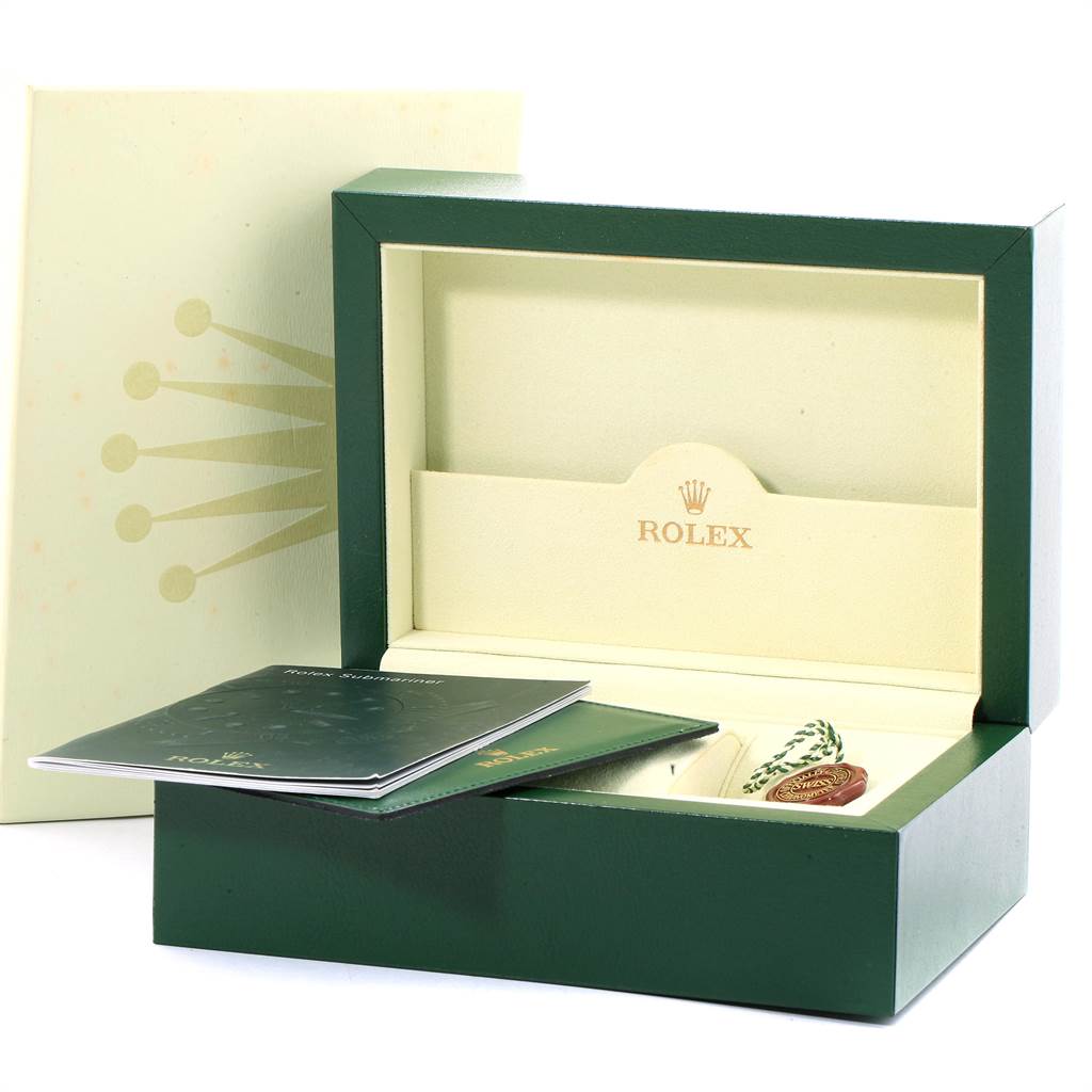 The image shows the packaging and instruction booklets for a Rolex Submariner 16610LV Men's Stainless Steel Black Dial 16610LV Men's Stainless Steel Black Dial watch, angled slightly from the side.