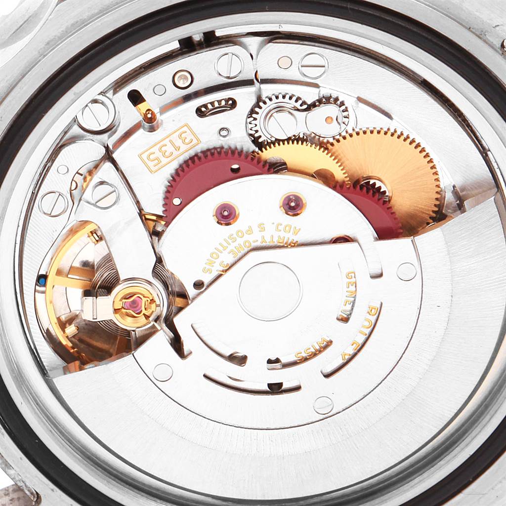 The image shows a close-up of the movement and internal components of a Rolex Submariner 16610LV Men's Stainless Steel Black Dial 16610LV Men's Stainless Steel Black Dial watch.