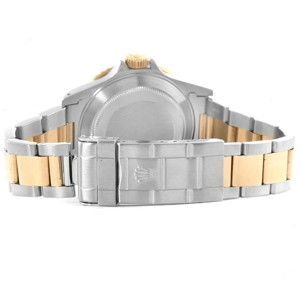 The image shows the back and bracelet of the Rolex Submariner 16613 Men
s Steel and Gold (two tone) Blue Dial 16613 Men
s Steel and Gold (two tone) Blue Dial, highlighting the clasp and case back.