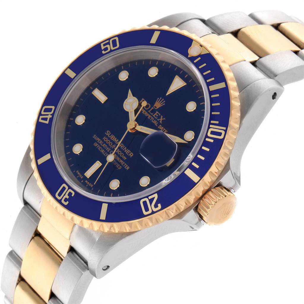 The image shows a Rolex Submariner 16613 Men
s Steel and Gold (two tone) Blue Dial 16613 Men
s Steel and Gold (two tone) Blue Dial watch angled from the side, highlighting the bezel, dial, crown, and part of the bracelet.