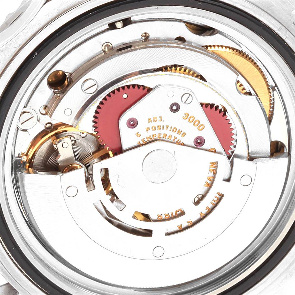 The image shows the internal movement and mechanics of a Rolex Submariner 14060 Men
s Stainless Steel Black Dial 14060 Men
s Stainless Steel Black Dial watch from a close-up angle.