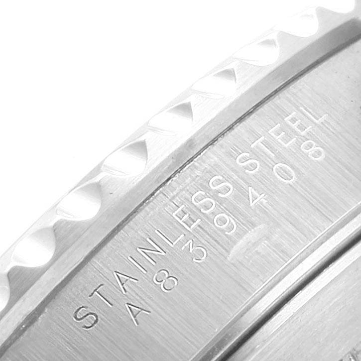 This image shows a close-up of the engraved stainless steel casing of a Rolex Submariner 14060 Men
s Stainless Steel Black Dial 14060 Men
s Stainless Steel Black Dial watch.