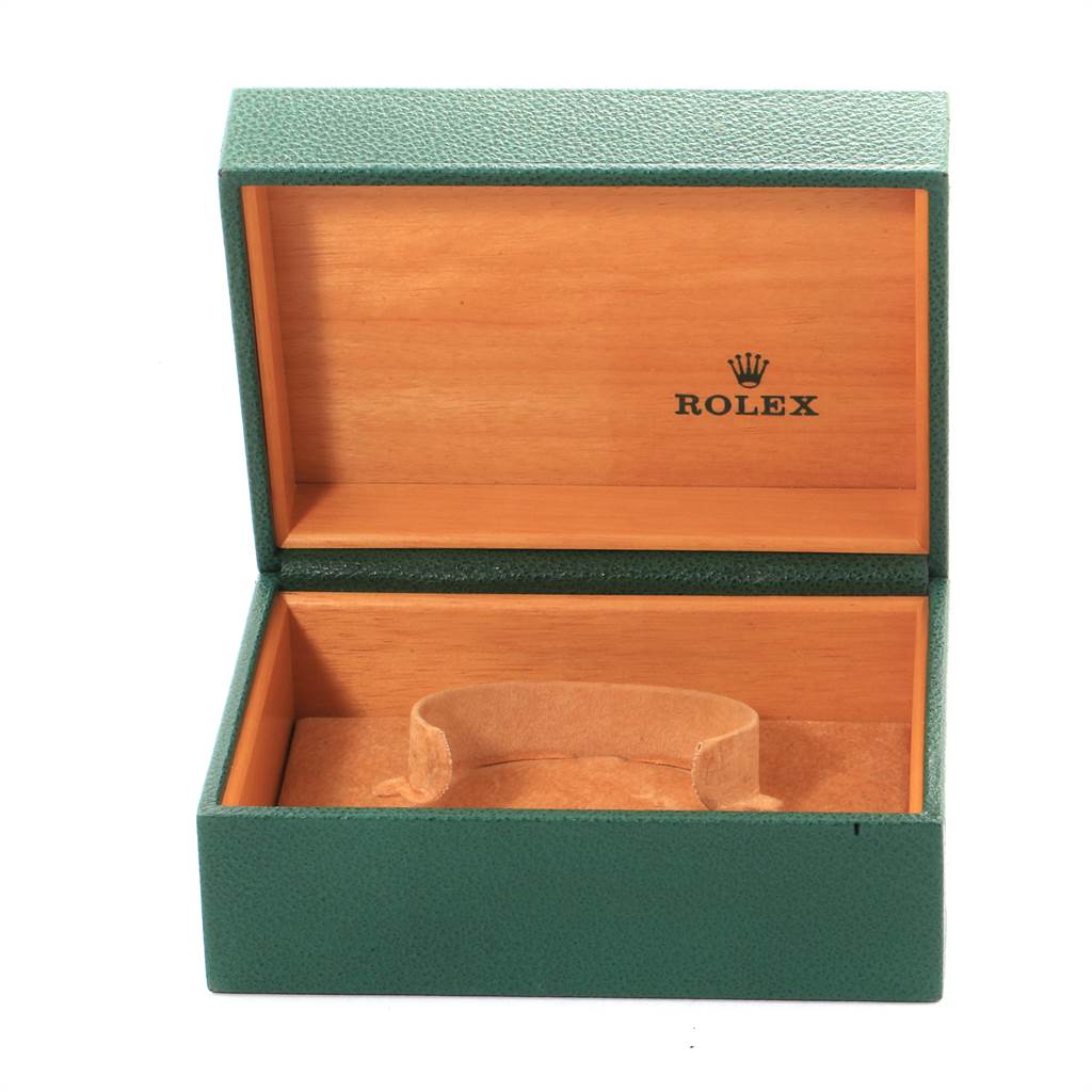 The image shows an open green and wood Rolex box without the Submariner watch inside.