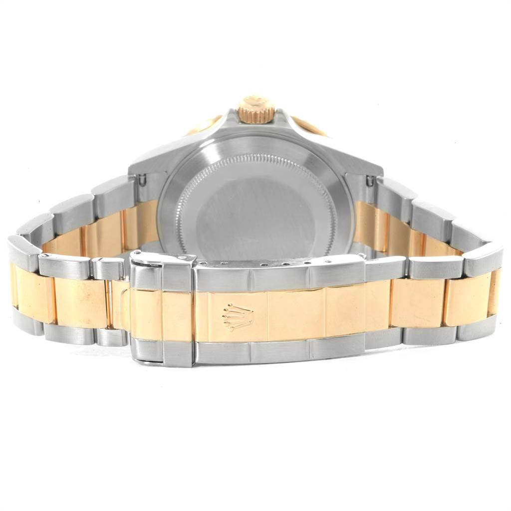 The image shows the back and bracelet of a Rolex Submariner 16613 Men
s Steel and Gold (two tone) Grey Dial 16613 Men
s Steel and Gold (two tone) Grey Dial watch, highlighting the case back and gold and silver links.