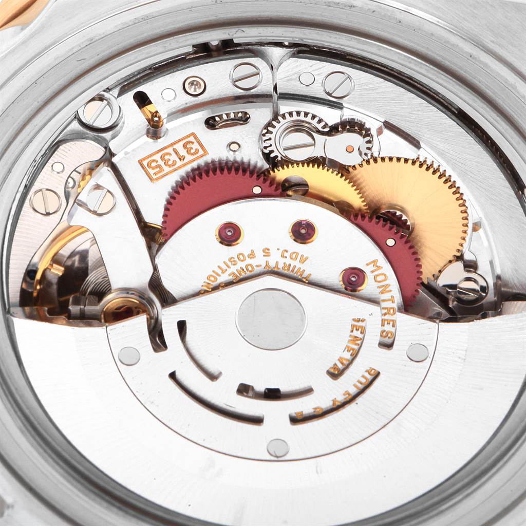 This image shows a close-up of the internal mechanical movement of a Rolex Submariner 16613 Men
s Steel and Gold (two tone) Blue Dial 16613 Men
s Steel and Gold (two tone) Blue Dial watch.