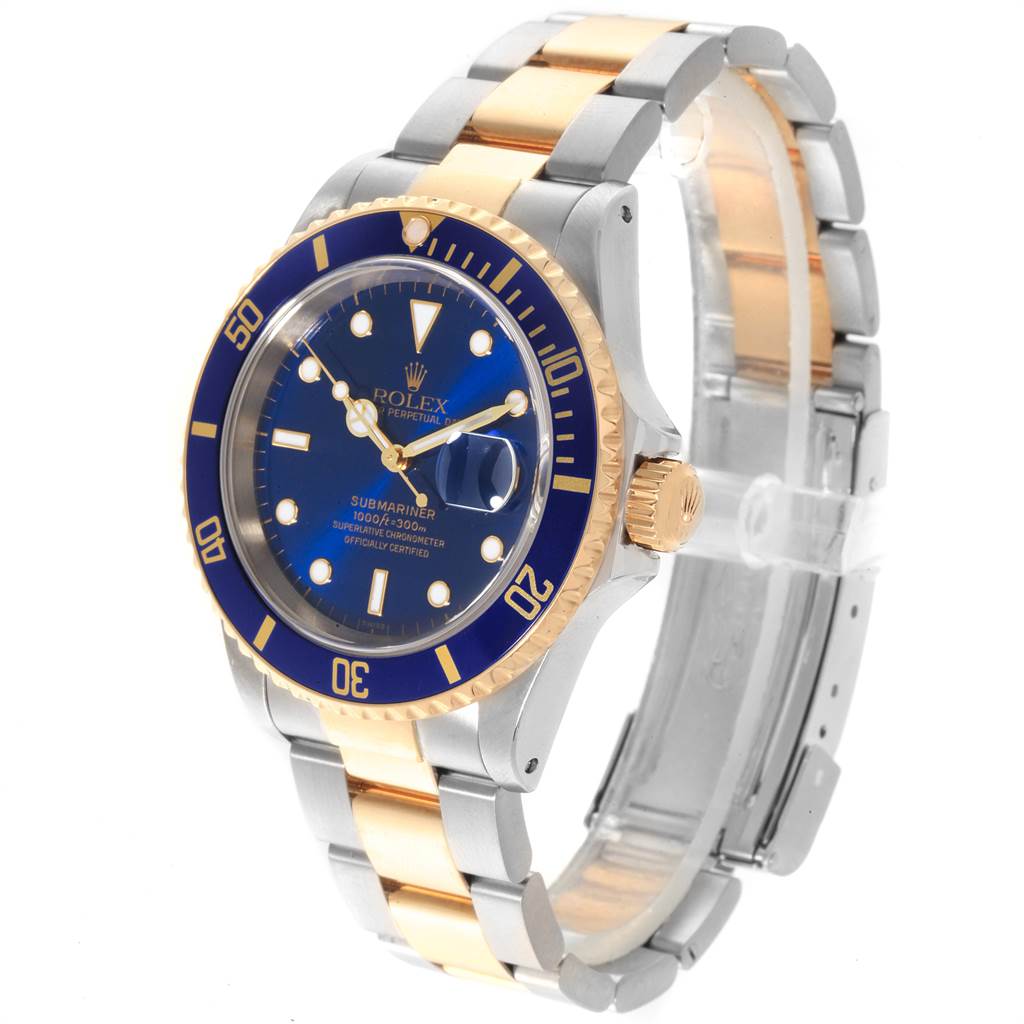 The image shows a Rolex Submariner 16613 Men
s Steel and Gold (two tone) Blue Dial 16613 Men
s Steel and Gold (two tone) Blue Dial watch at a three-quarter angle, displaying the face, bezel, crown, and bracelet.