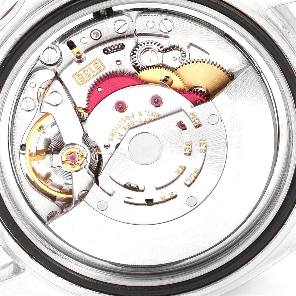 The image shows a close-up view of the internal movement mechanisms of a Rolex Submariner 16610 Men
s Stainless Steel Black Dial 16610 Men
s Stainless Steel Black Dial watch.