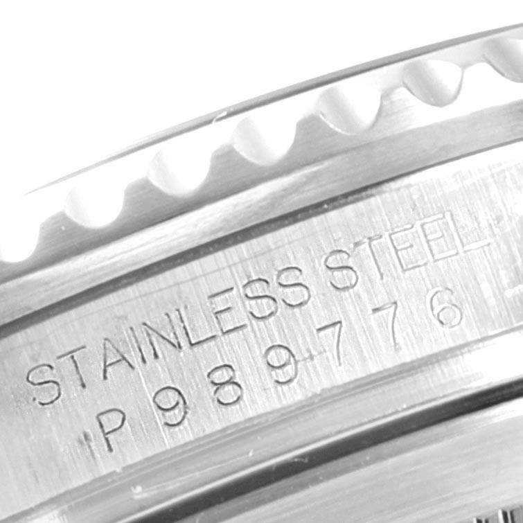 This close-up image shows the engraved serial number and stainless steel marking on the case of a Rolex Submariner 16610 Men
s Stainless Steel Black Dial 16610 Men
s Stainless Steel Black Dial watch.