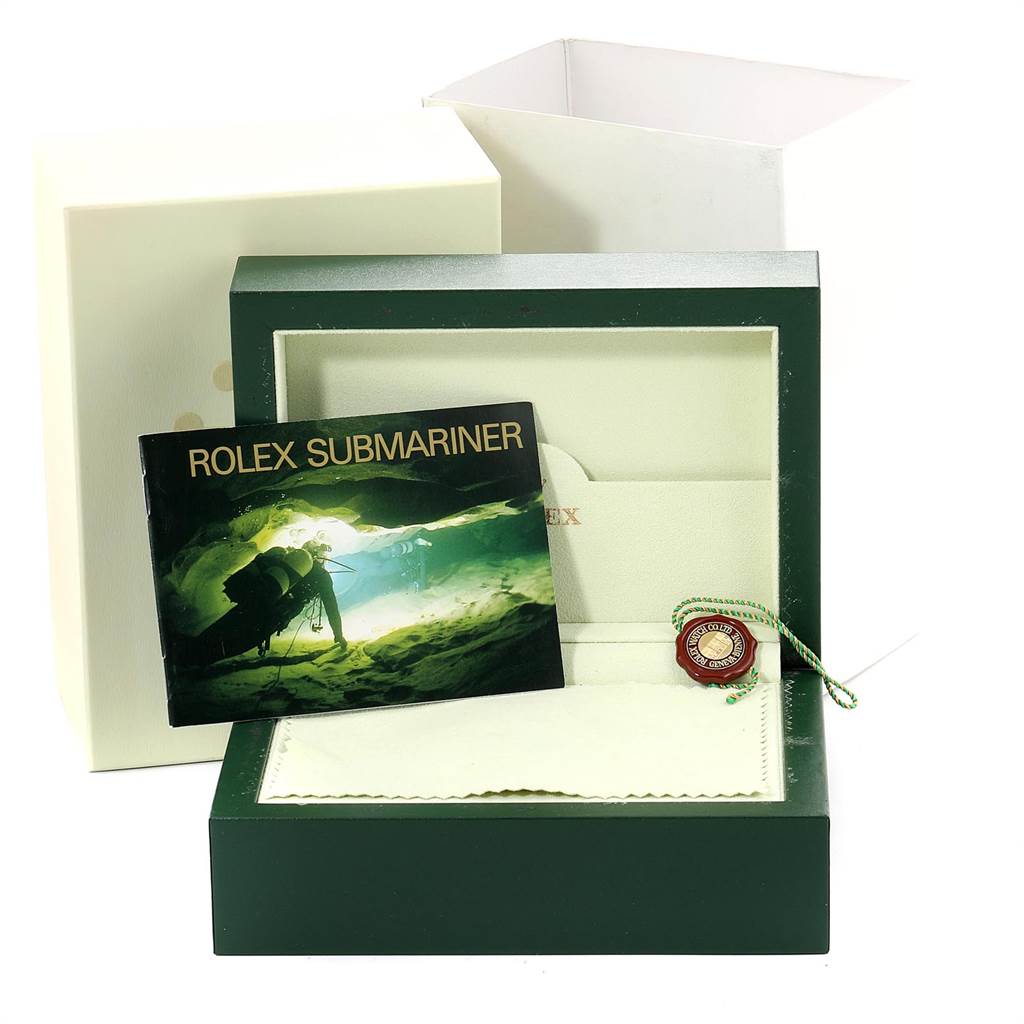 The image shows the packaging, booklet, tag, cleaning cloth, and inner box for the Rolex Submariner 16610LV Men
s Stainless Steel Black Dial 16610LV Men
s Stainless Steel Black Dial watch.