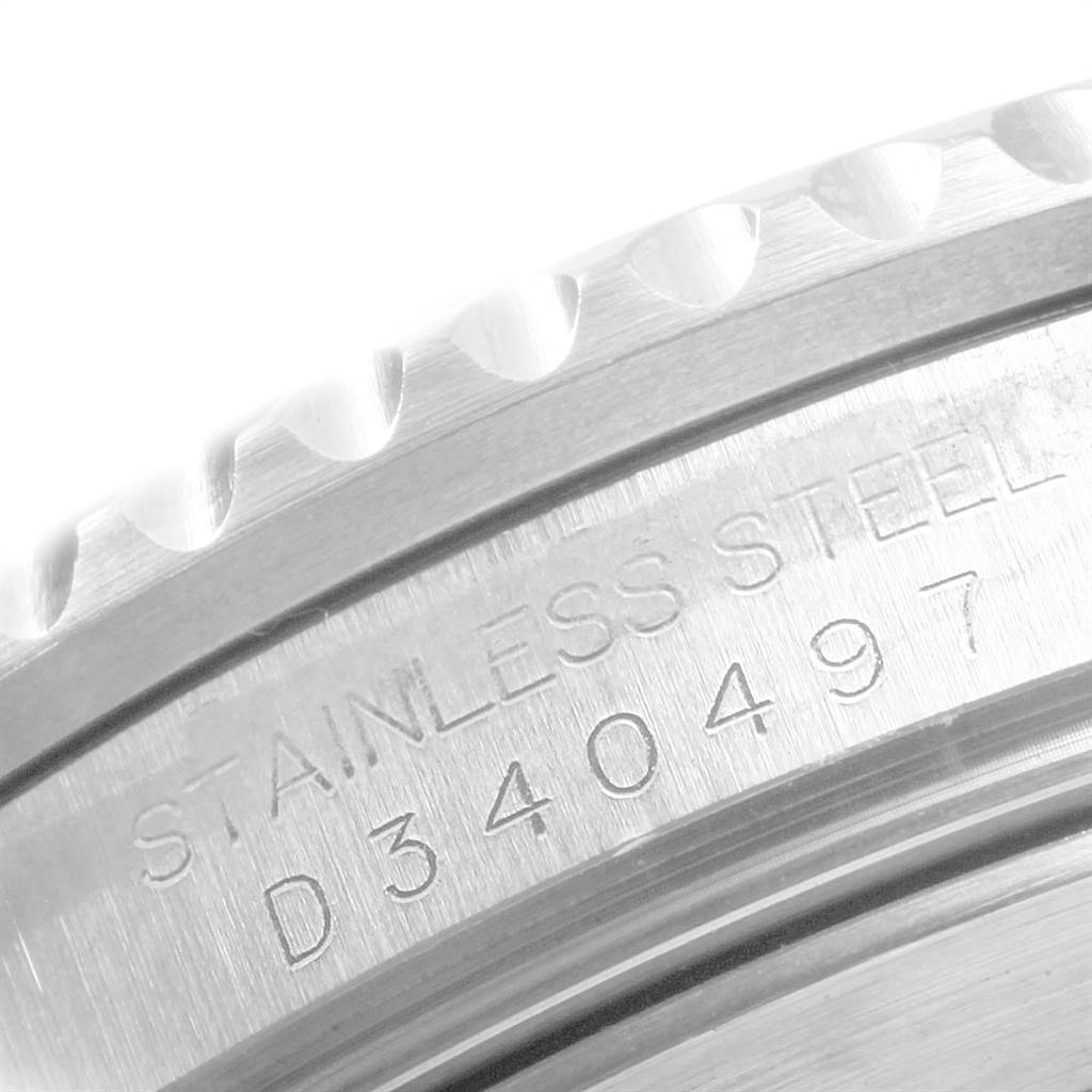 This image shows a close-up of the bezel and serial number engraving on a stainless steel Rolex Submariner 16610 Men
s Stainless Steel Black Dial 16610 Men
s Stainless Steel Black Dial watch.