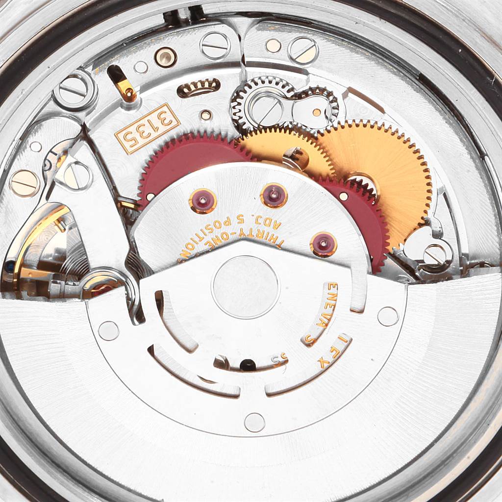 The image shows the internal mechanical movement of a Rolex Submariner 16610 Men
s Stainless Steel Black Dial 16610 Men
s Stainless Steel Black Dial watch from a close-up angle.